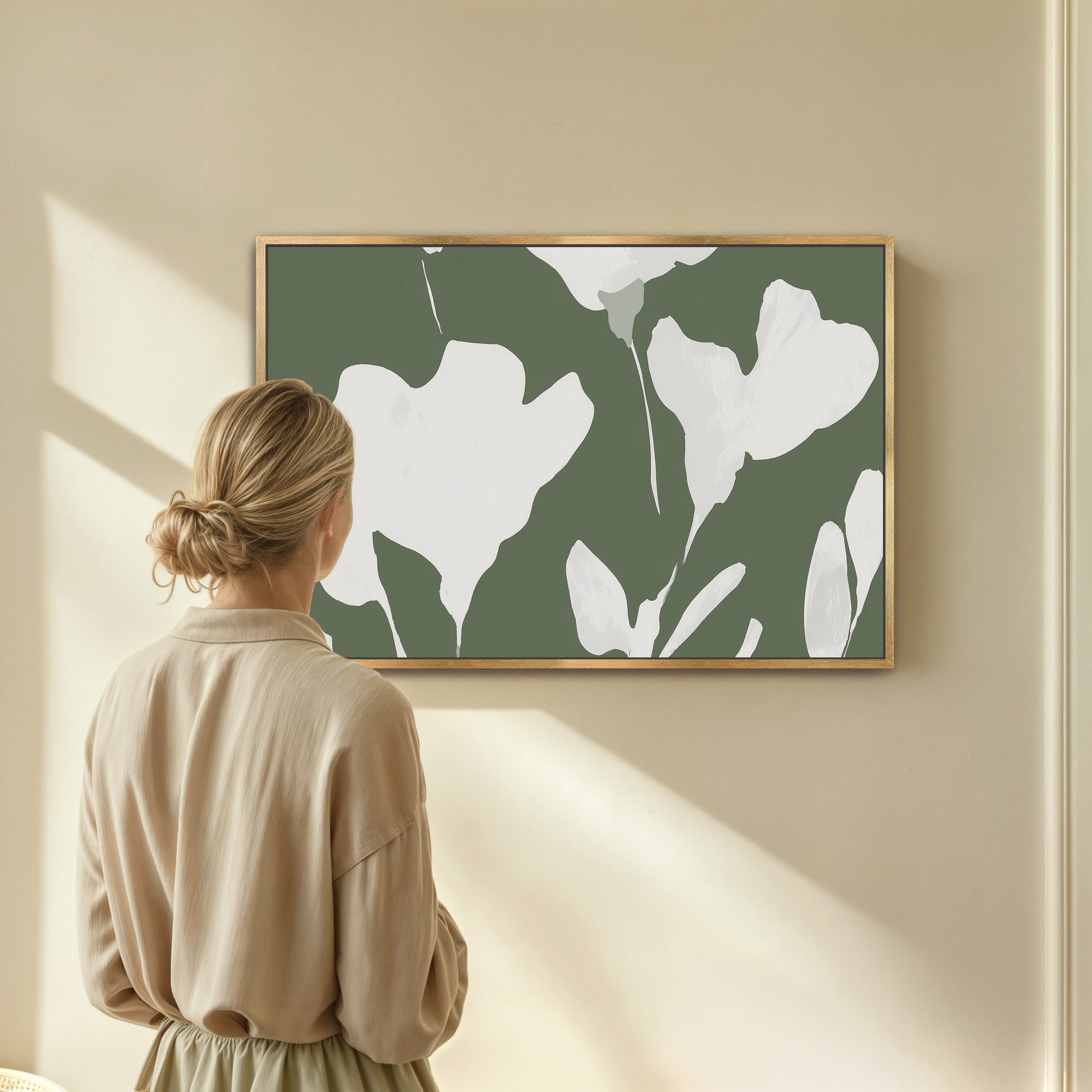 Verdal Canvas Print with ivory floral silhouettes on muted olive background in wooden frame hung in modern neutral room