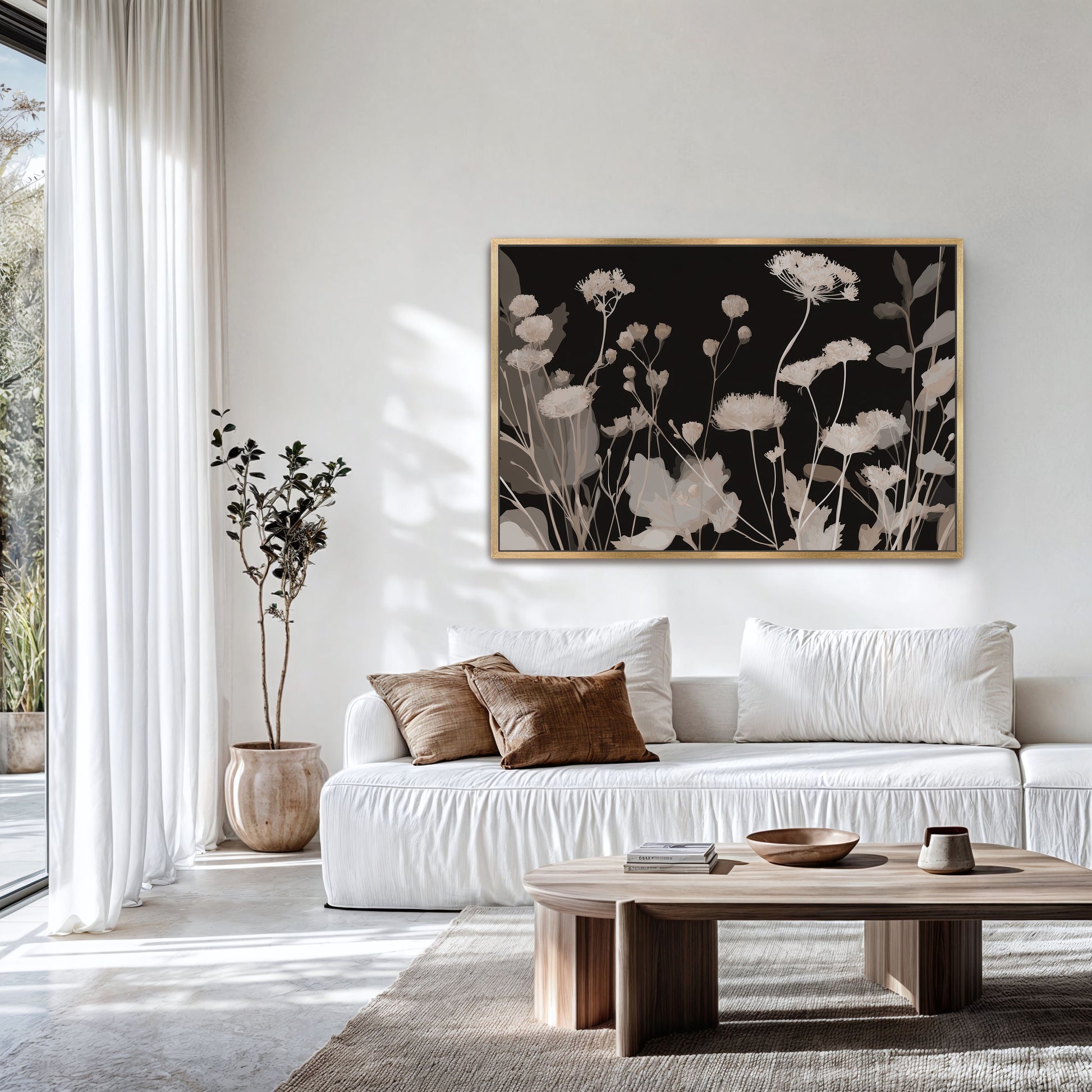 Shadow Bloom canvas art with neutral wildflowers on a deep black background in a modern living room