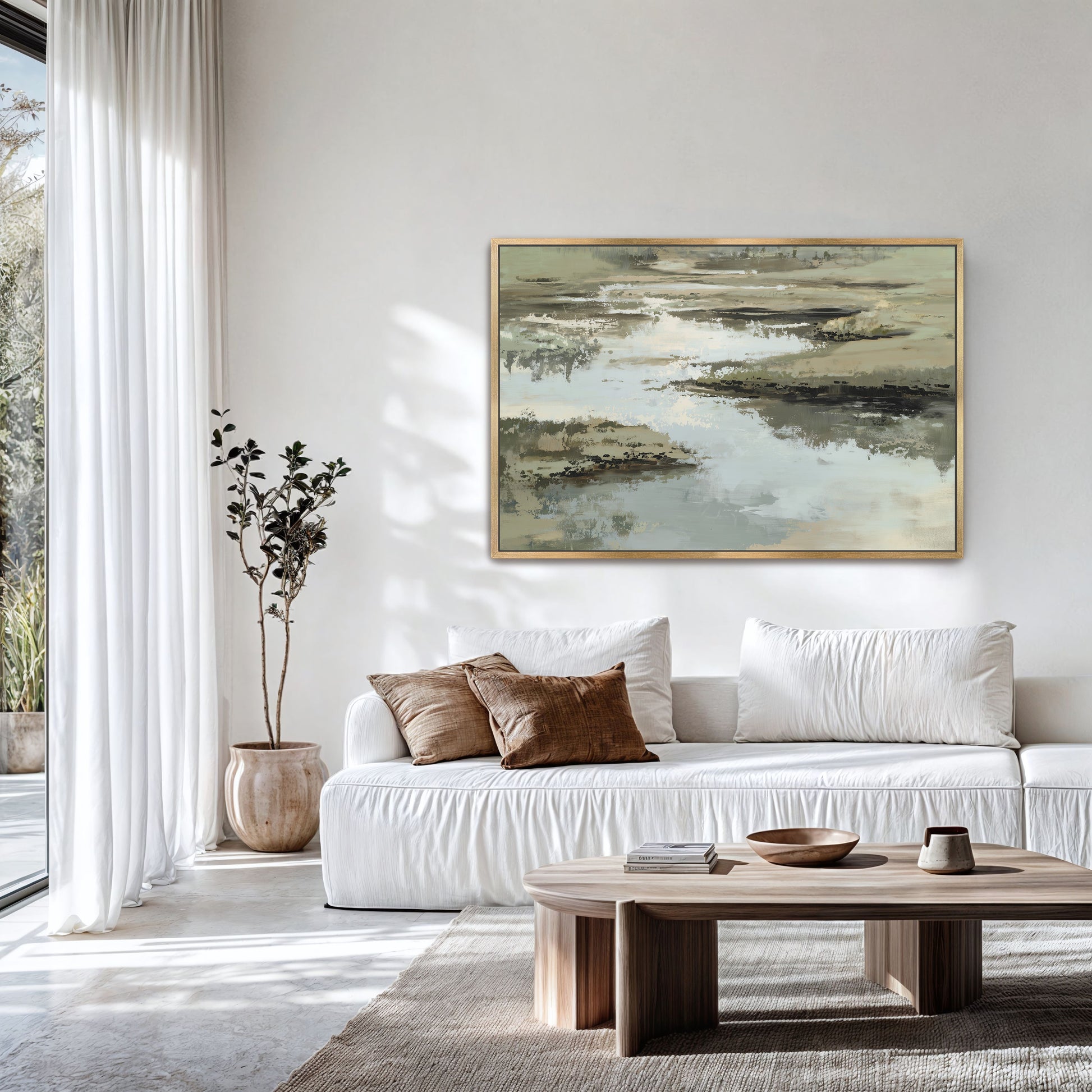 Reed canvas print abstract nature art in sage, sand, and ivory tones above white sofa in modern living room