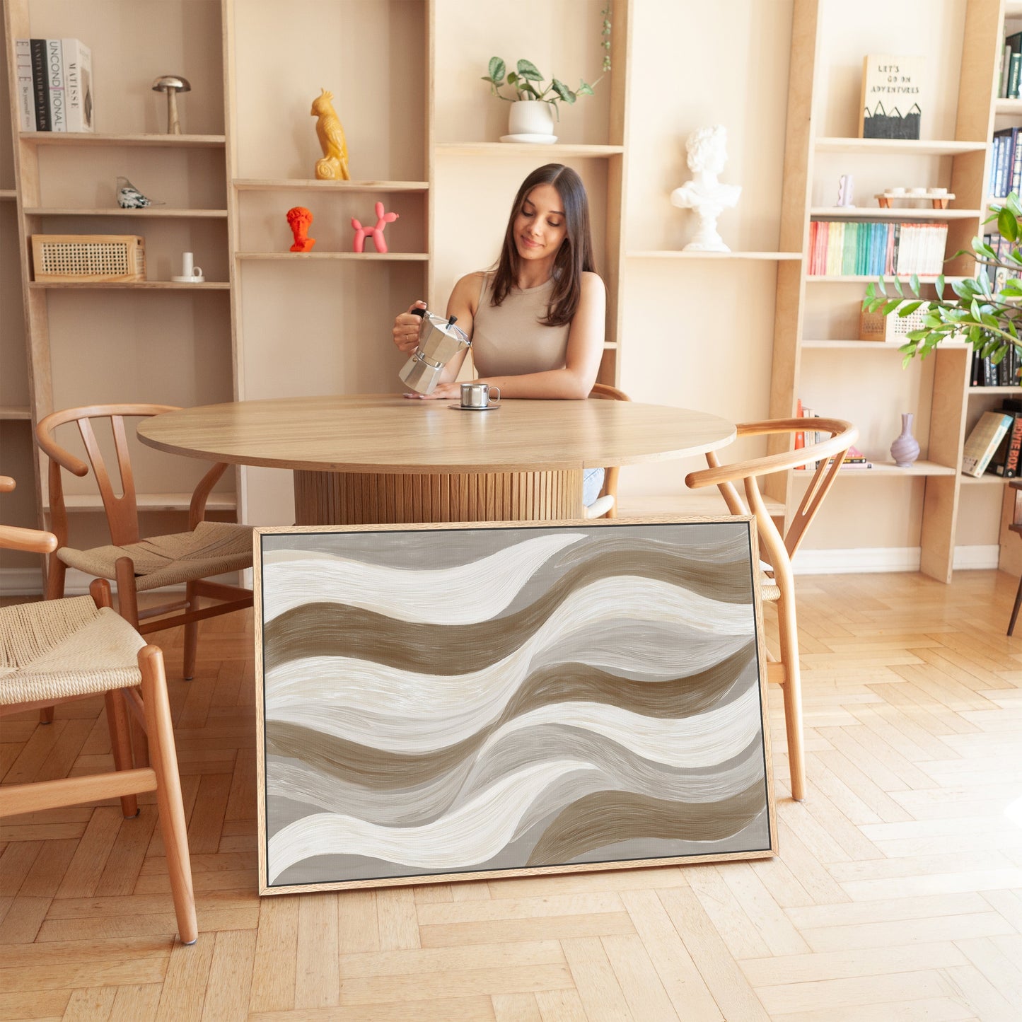 Abstract 'Flux' canvas print with cream, taupe, and clay soft wave brushstrokes in a modern neutral interior.