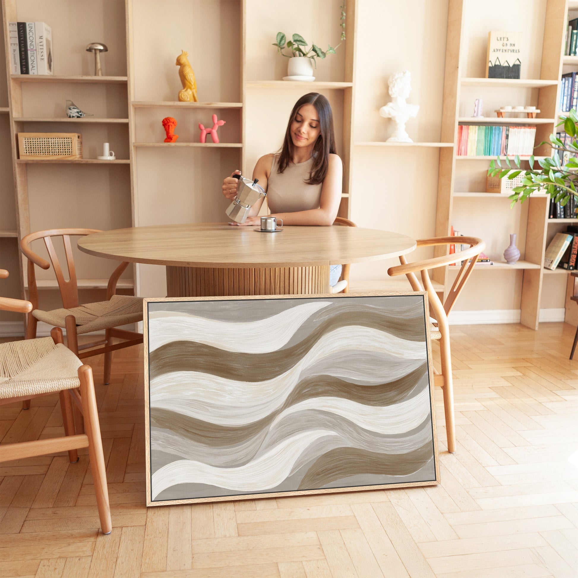 Abstract 'Flux' canvas print with cream, taupe, and clay soft wave brushstrokes in a modern neutral interior.