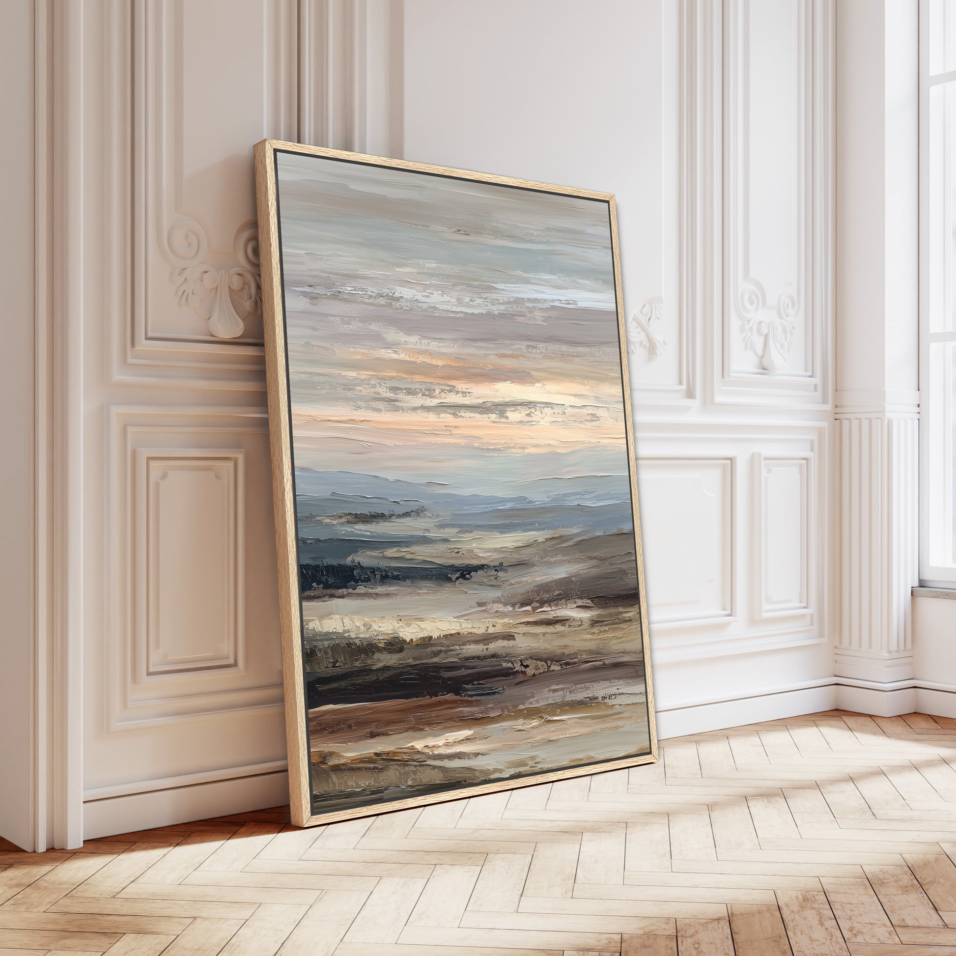 a large, framed painting of a landscape with a sunset over a body of water.