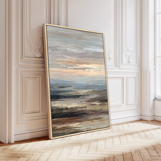 a large, framed painting of a landscape with a sunset over a body of water.