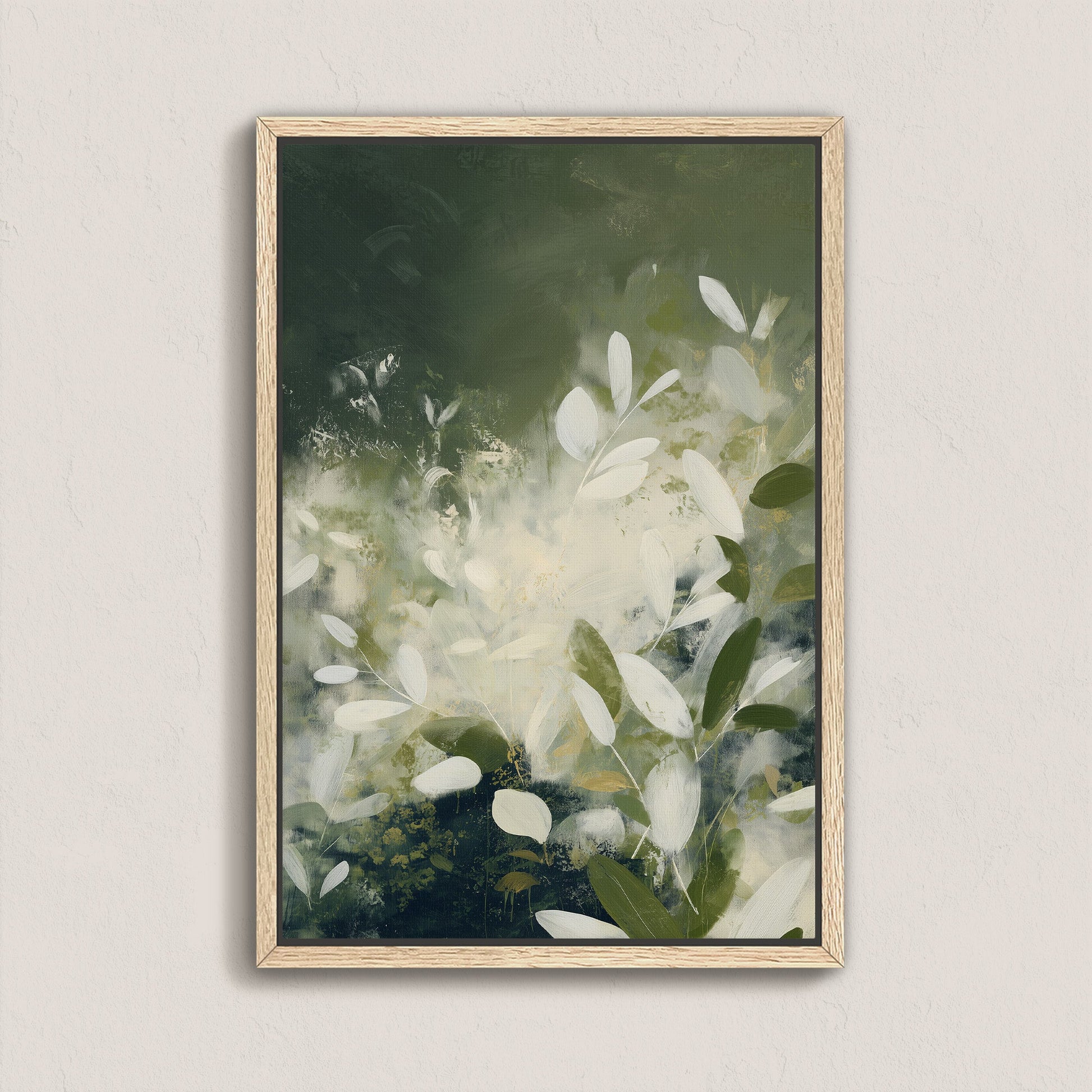 Verdure canvas wall art featuring soft ivory leaves and deep green tones in a modern botanical abstract design with a natural wood frame