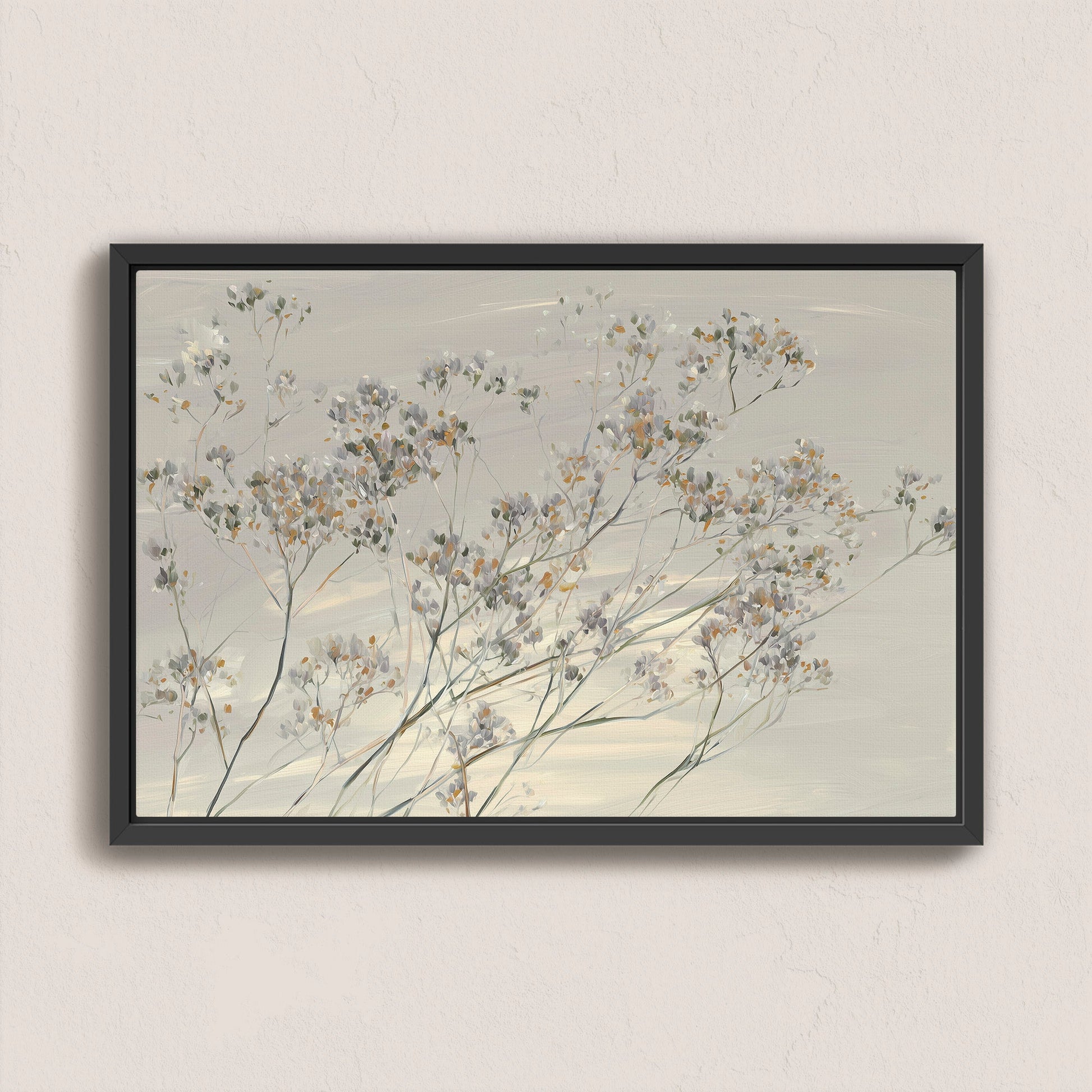 'Breeze' Wall Art canvas featuring delicate wildflowers in muted tones with black frame on neutral wall