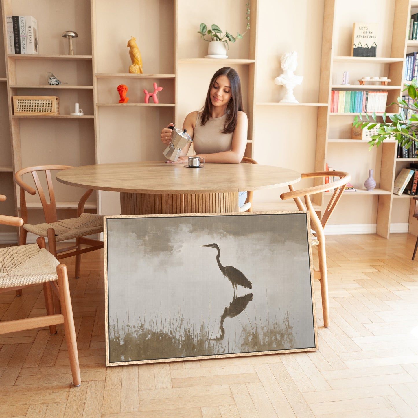Wade canvas print of a heron reflecting in calm water in muted earth tones, displayed in a modern room.