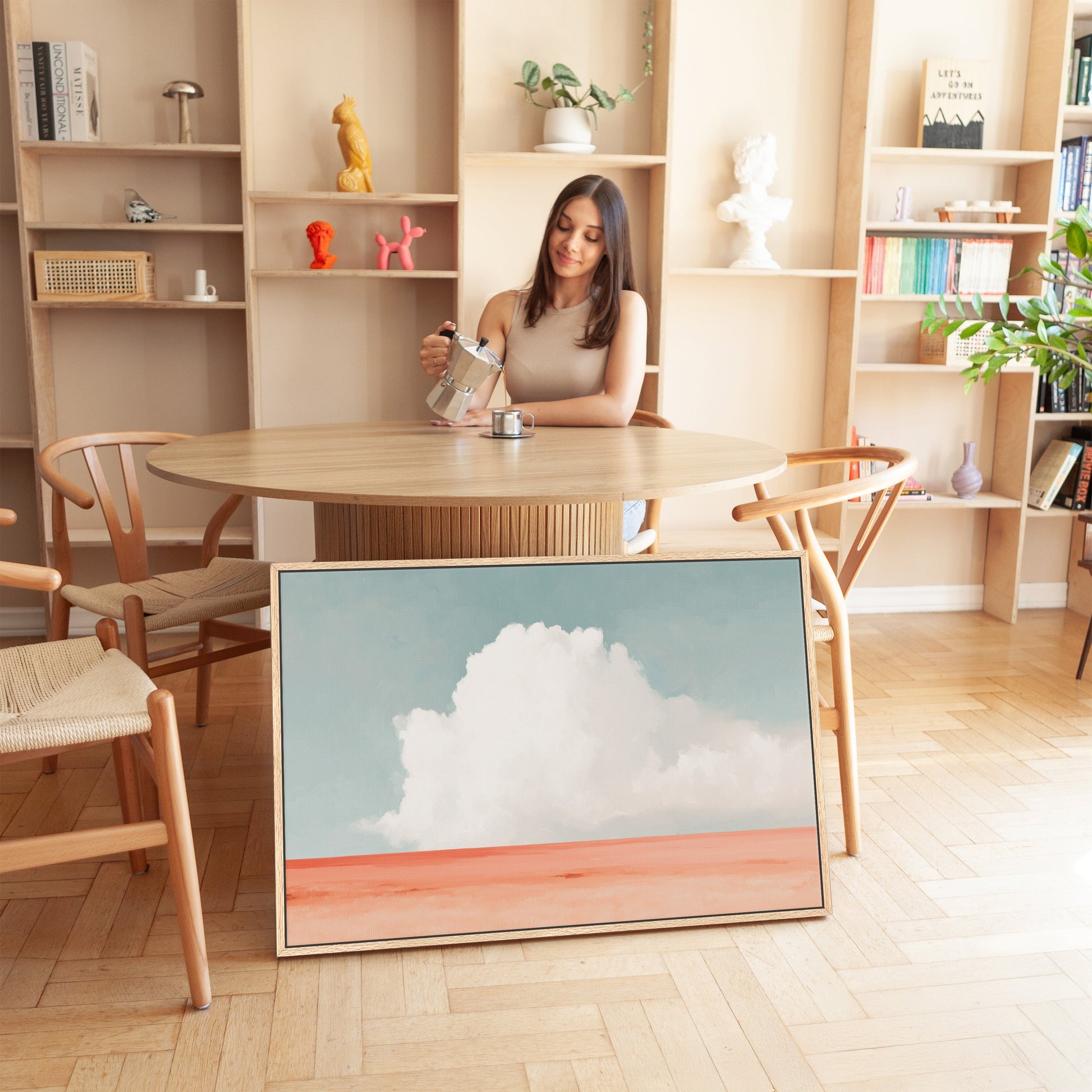Aurea Canvas Wall Art featuring a white cloud over coral horizon in coastal minimalist room