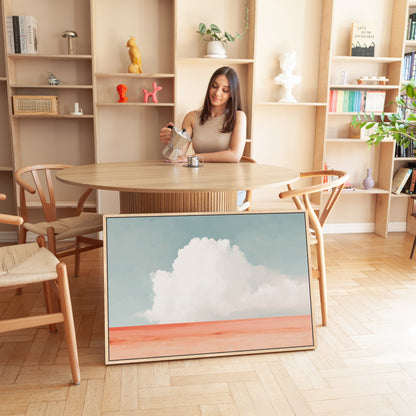 Aurea Canvas Wall Art featuring a white cloud over coral horizon in coastal minimalist room