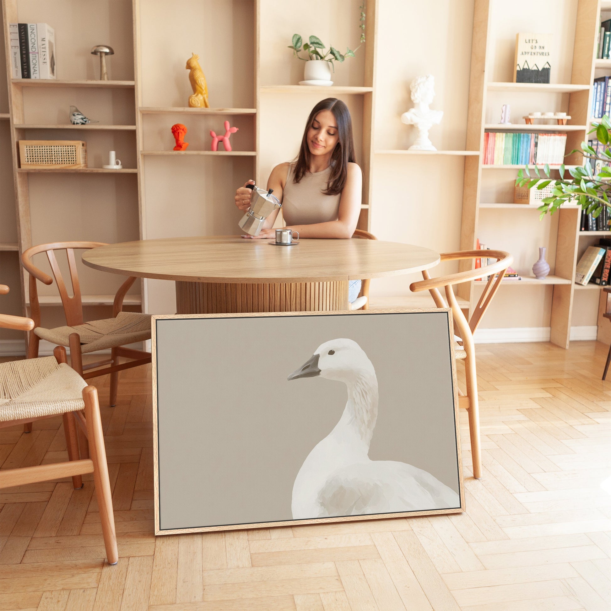 Grace Canvas Print featuring a minimalist white bird in soft cream and beige tones displayed in a modern room setting