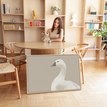 Grace Canvas Print featuring a minimalist white bird in soft cream and beige tones displayed in a modern room setting