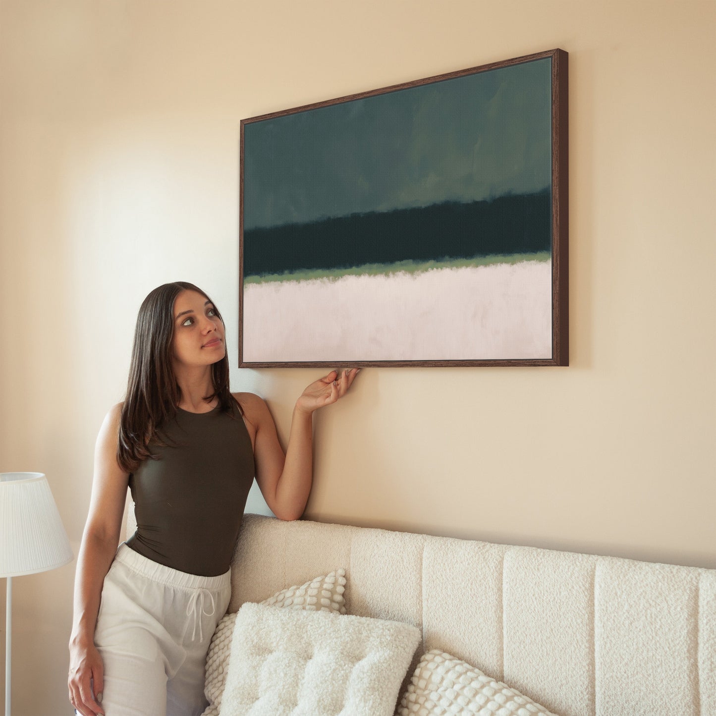 Modern Shade canvas print with deep olive and neutral tones, framed and hanging in a minimal living room setting