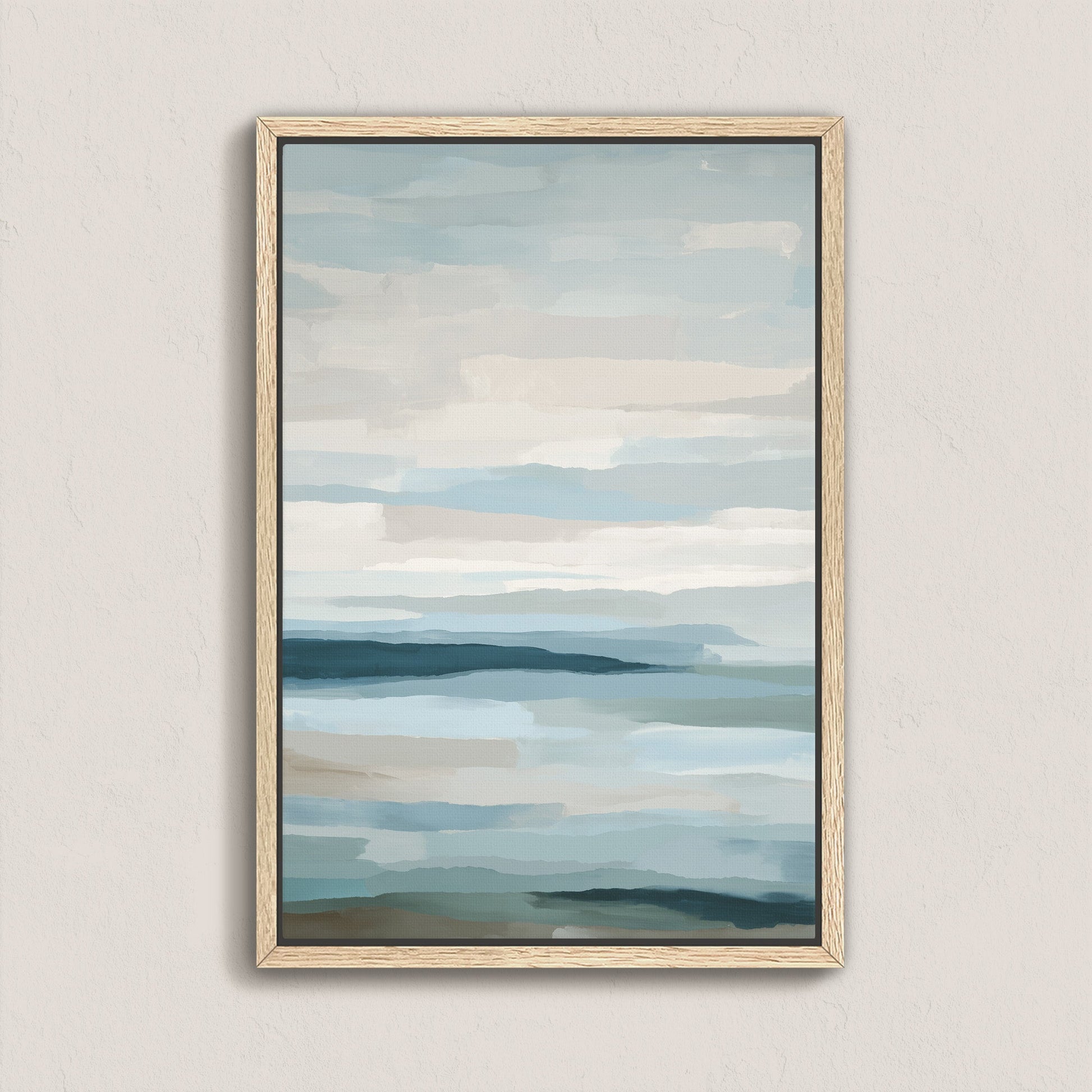 Lapse canvas print of abstract sea and sky in soft blue, ivory, and sand tones with natural wood frame.
