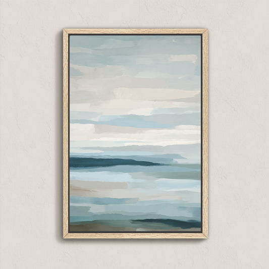 Lapse canvas print of abstract sea and sky in soft blue, ivory, and sand tones with natural wood frame.