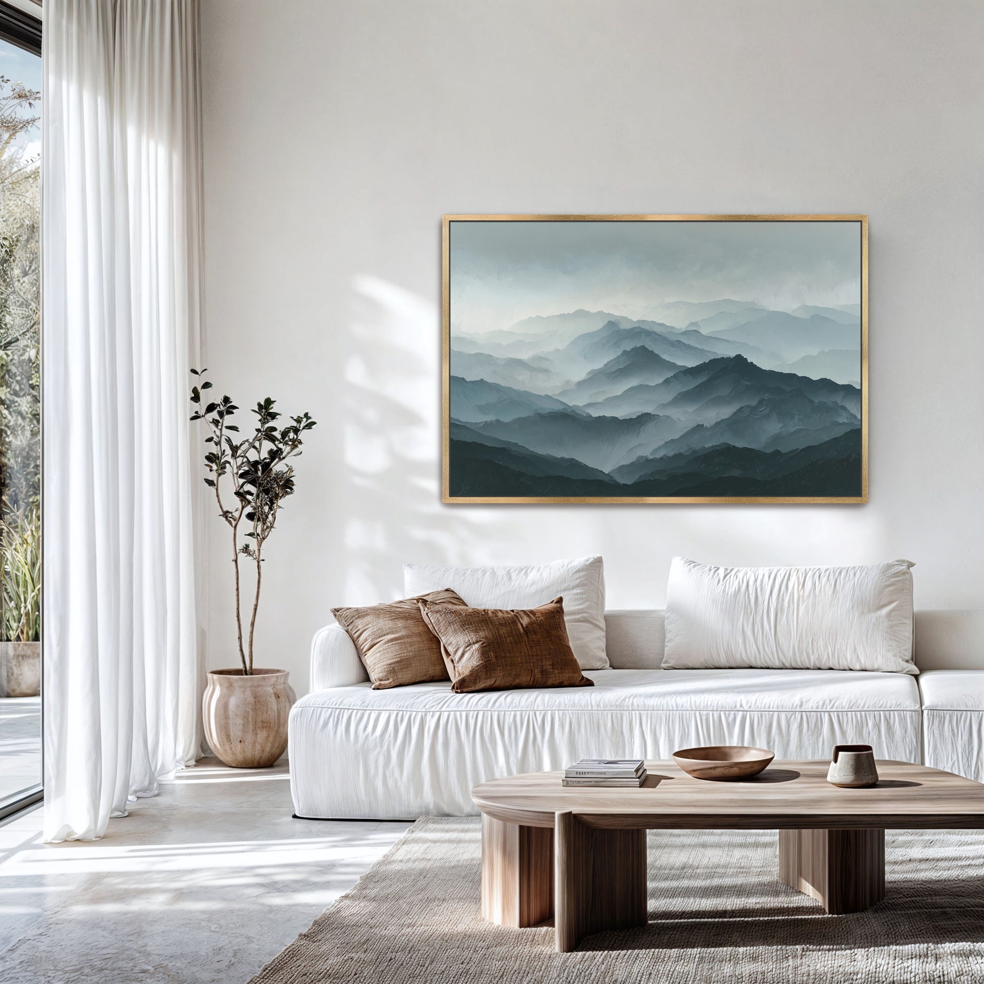 a serene living room with a large painting of a mountain landscape hanging on the wall. The room is decorated with a white sofa, a wooden coffee table, and a potted plant. The overall atmosphere of the room is calm and inviting, with the natural elements of the painting and the indoor plants contributing to the peaceful ambiance.