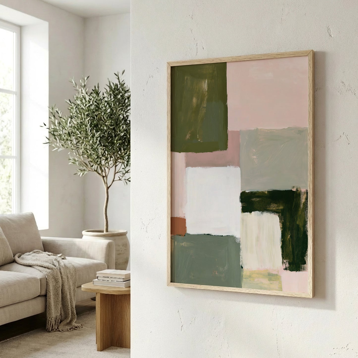 a living room with a large abstract painting hanging on the wall, a comfortable couch, and a potted plant.