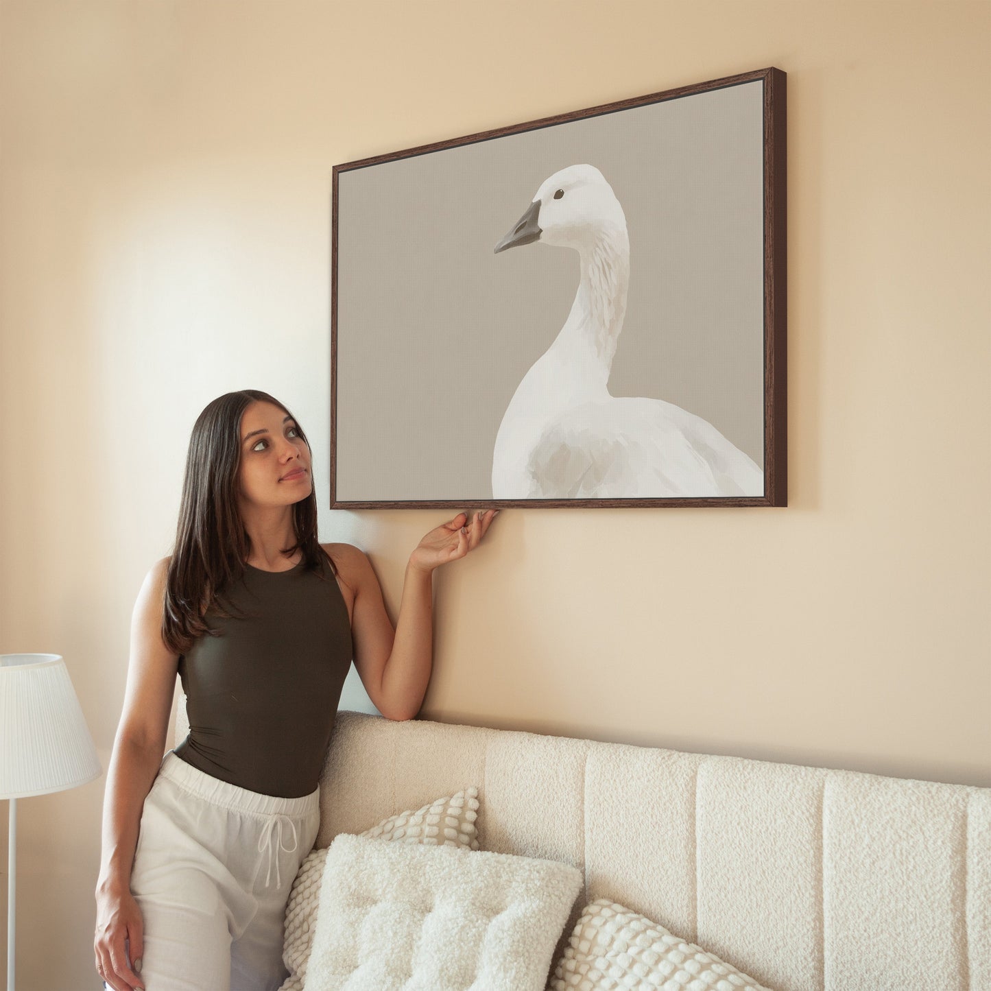 Grace Canvas Print featuring a white bird in soft cream and beige tones, displayed in a minimalist modern room.