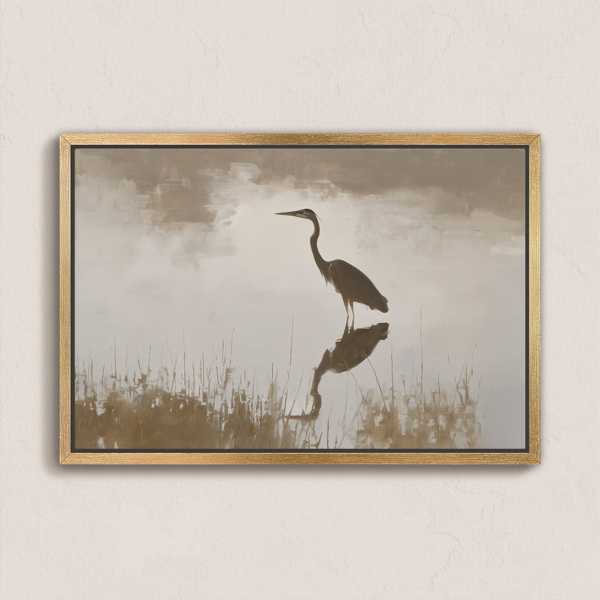 Wade canvas print of a heron standing in calm water with muted earth tones and gold frame
