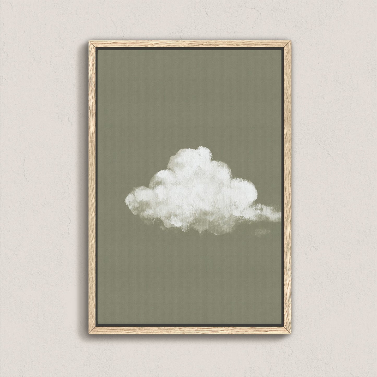 'Trace' Canvas Print featuring a single white cloud on a muted sage background in a natural wood frame