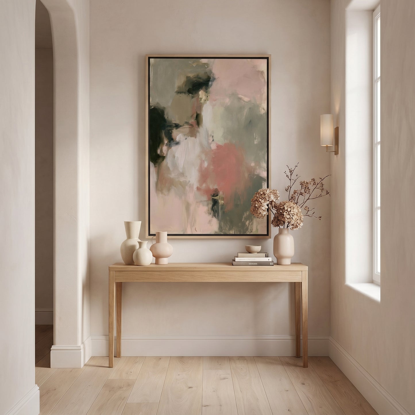 a minimalist interior design with a large abstract painting hanging on the wall above a wooden console table. The table has three white vases and a small plant, creating a harmonious and visually appealing arrangement.