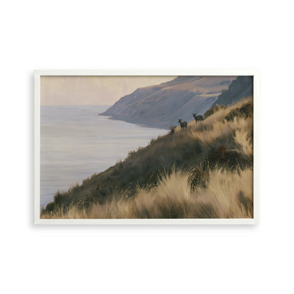 a serene landscape with a grassy hill overlooking a body of water, possibly a lake or ocean. Two deer can be seen standing on the hill, adding a sense of tranquility to the scene.