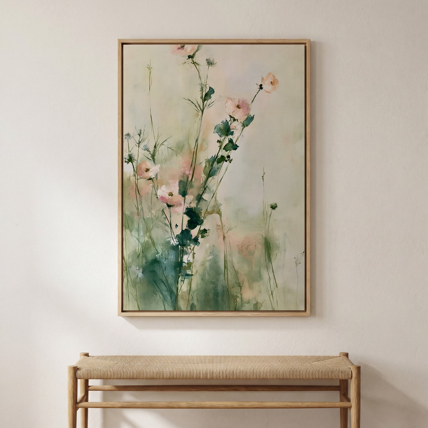 a large painting of flowers hanging on a wall above a wooden bench.