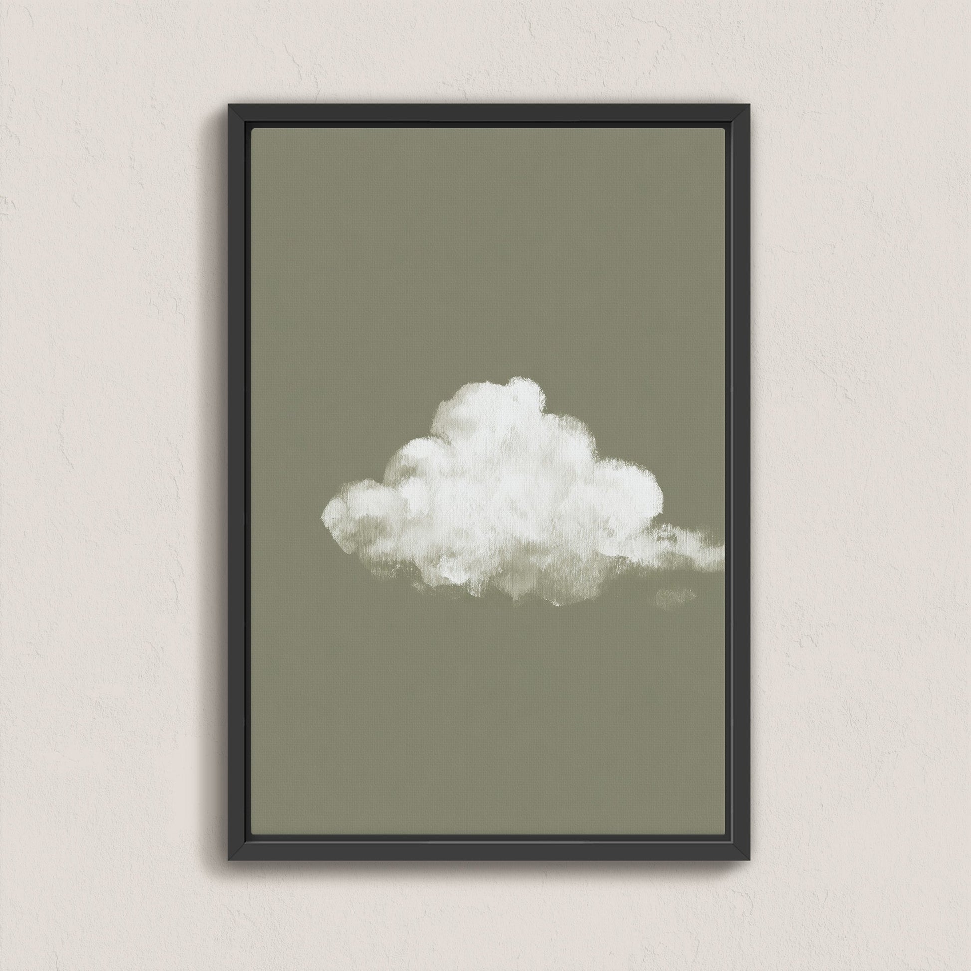 Minimalist 'Trace' canvas print featuring a single white cloud on a muted sage background in a black floating frame