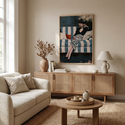 a cozy living room with a large painting of a woman sitting on a striped couch, a wooden sideboard, a beige sofa, a coffee table, and a lamp.