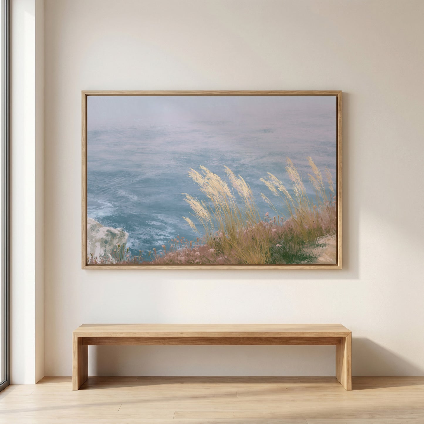 a large painting of a serene landscape with a body of water and grassy areas, hanging on a wall above a wooden bench.