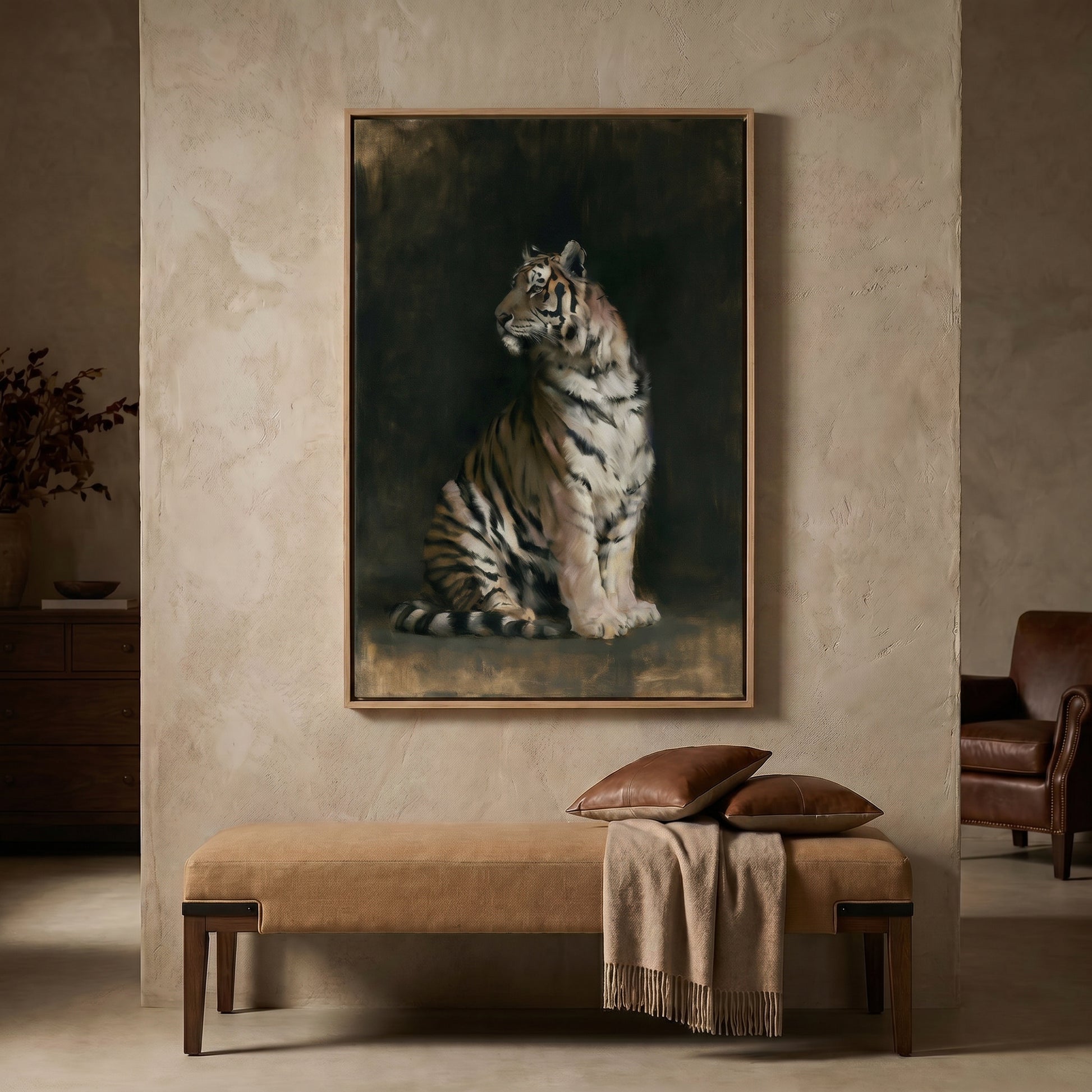 a large painting of a tiger sitting on a bench, which is mounted on a wall in a room with a leather chair and a wooden dresser.