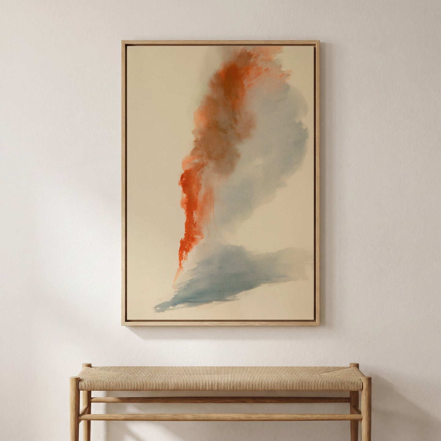 a large abstract painting hanging on a white wall above a wooden bench.
