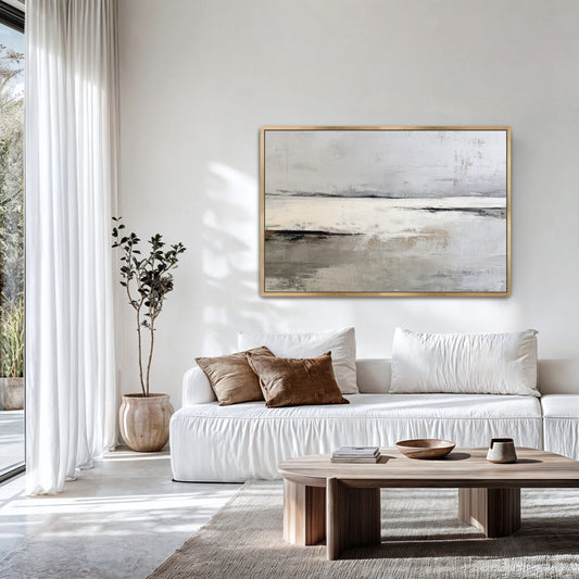 a modern living room with a large white sofa, a wooden coffee table, and a large abstract painting hanging on the wall above the sofa.