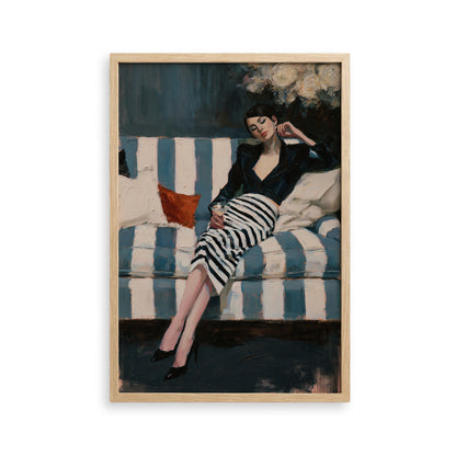A woman in a black and white striped dress is sitting on a blue and white striped couch, holding a drink in her hand.
