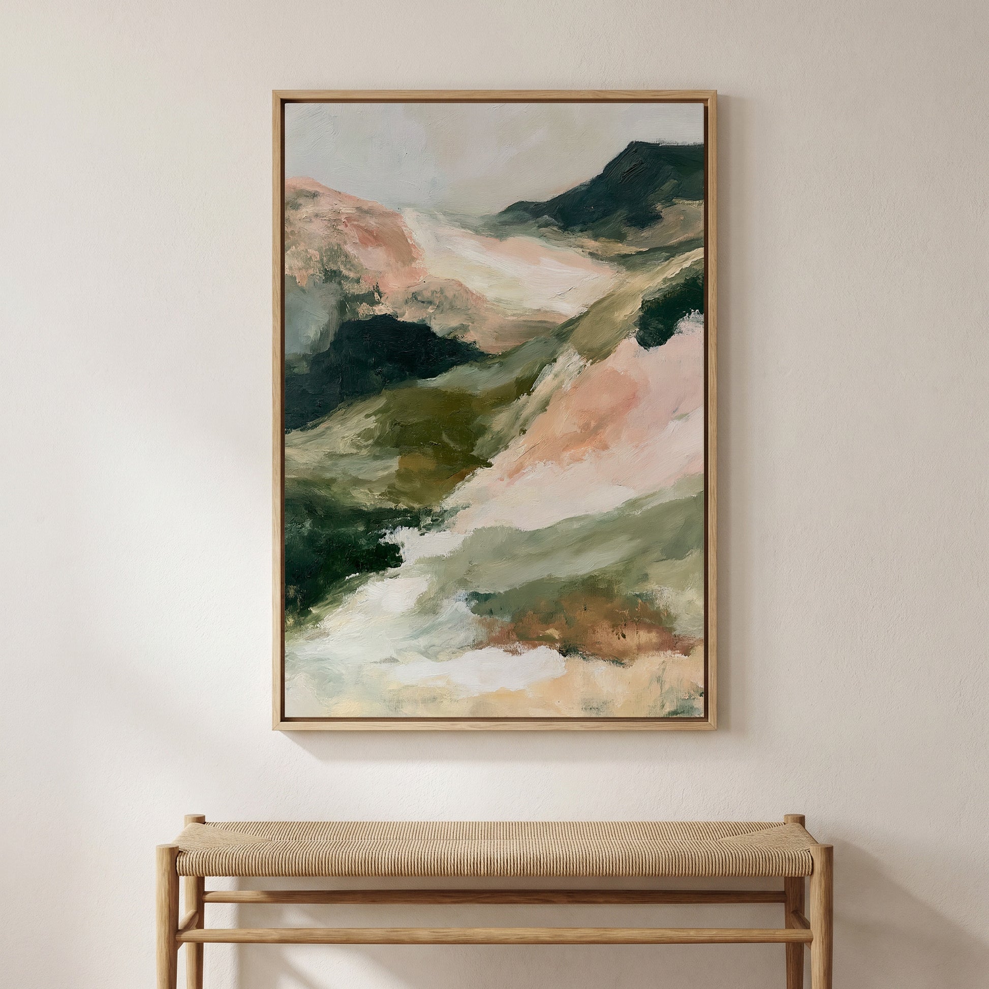 a large abstract landscape painting hanging on a wall above a wooden bench.