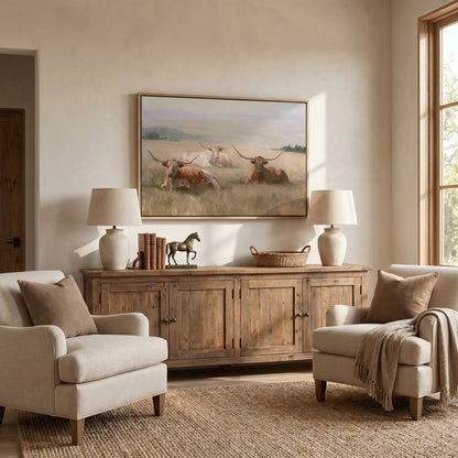 a cozy living room with a large painting of cows on the wall, a wooden cabinet, two armchairs, and a rug on the floor.