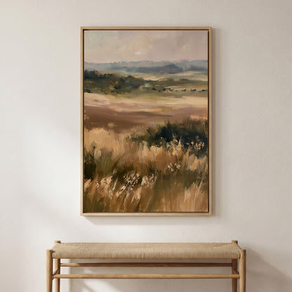 a large landscape painting hanging on a wall above a wooden bench.
