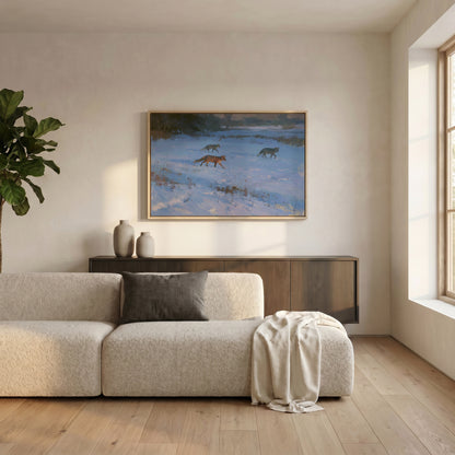 a cozy living room with a large window, a beige sofa, a wooden cabinet, and a framed painting of three foxes in a snowy landscape.