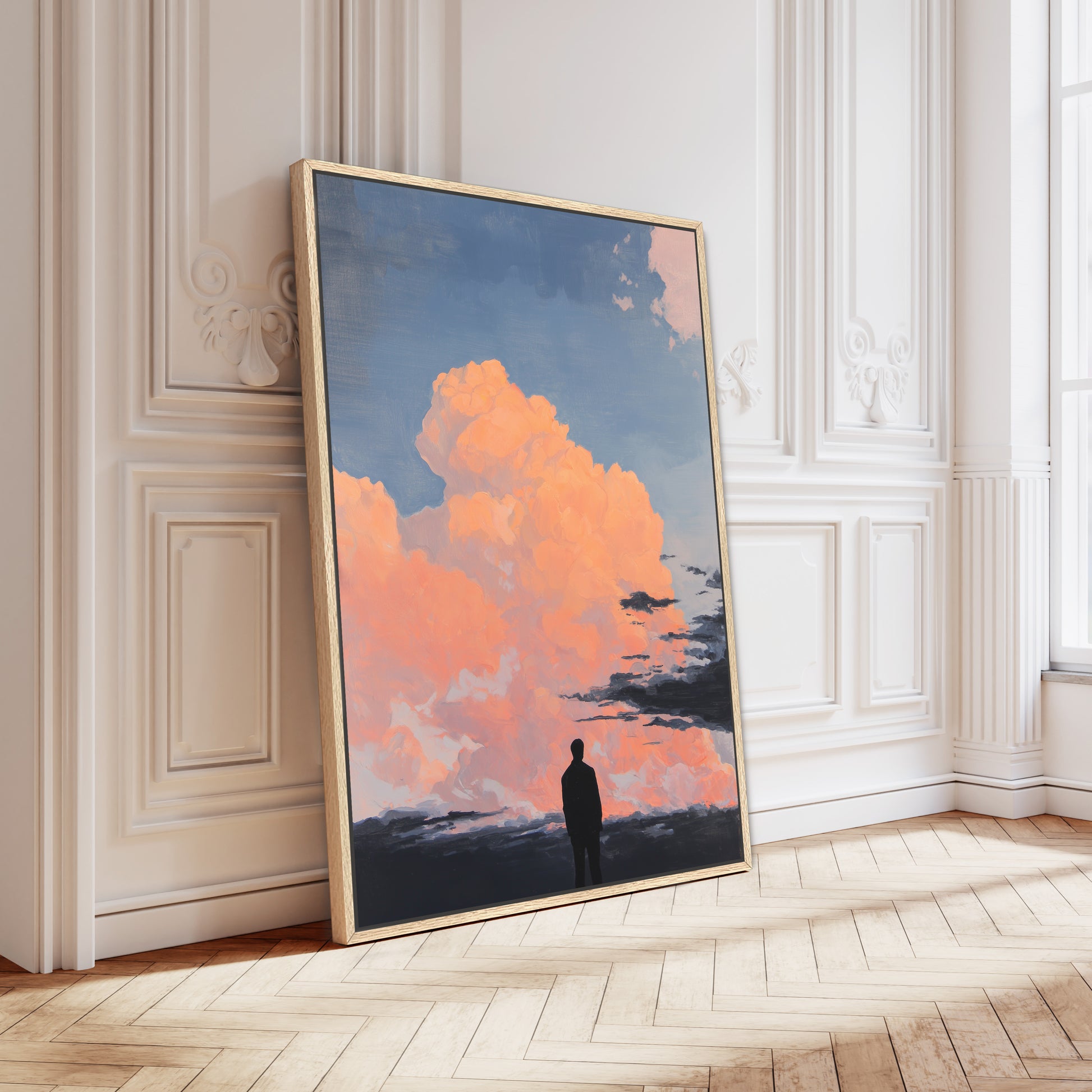 a large framed painting depicting a person standing in front of a picturesque sky with clouds and a sunset.