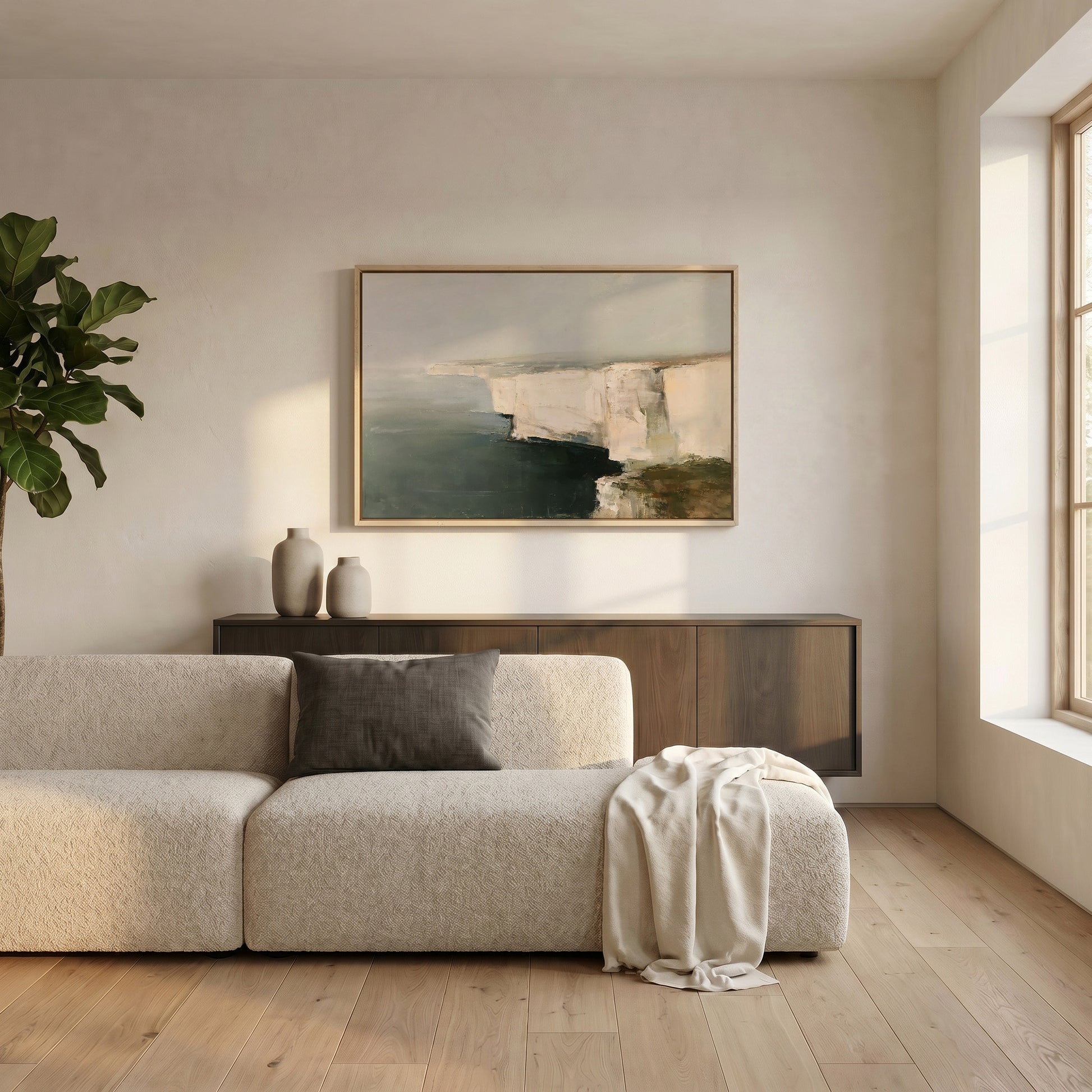 a modern living room with a large window, a white sofa, a wooden cabinet, and a framed landscape painting on the wall.
