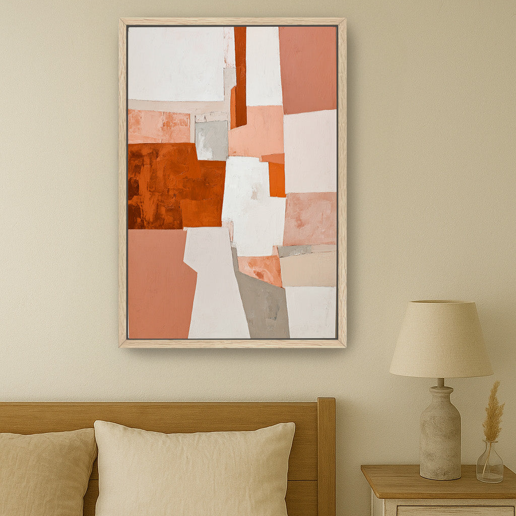 a bedroom with a large abstract painting hanging on the wall above a bed with a wooden headboard. The painting has a vibrant mix of orange, pink, and white colors. The bed is neatly made with a white comforter and two pillows. To the side of the bed, there is a nightstand with a lamp on it.