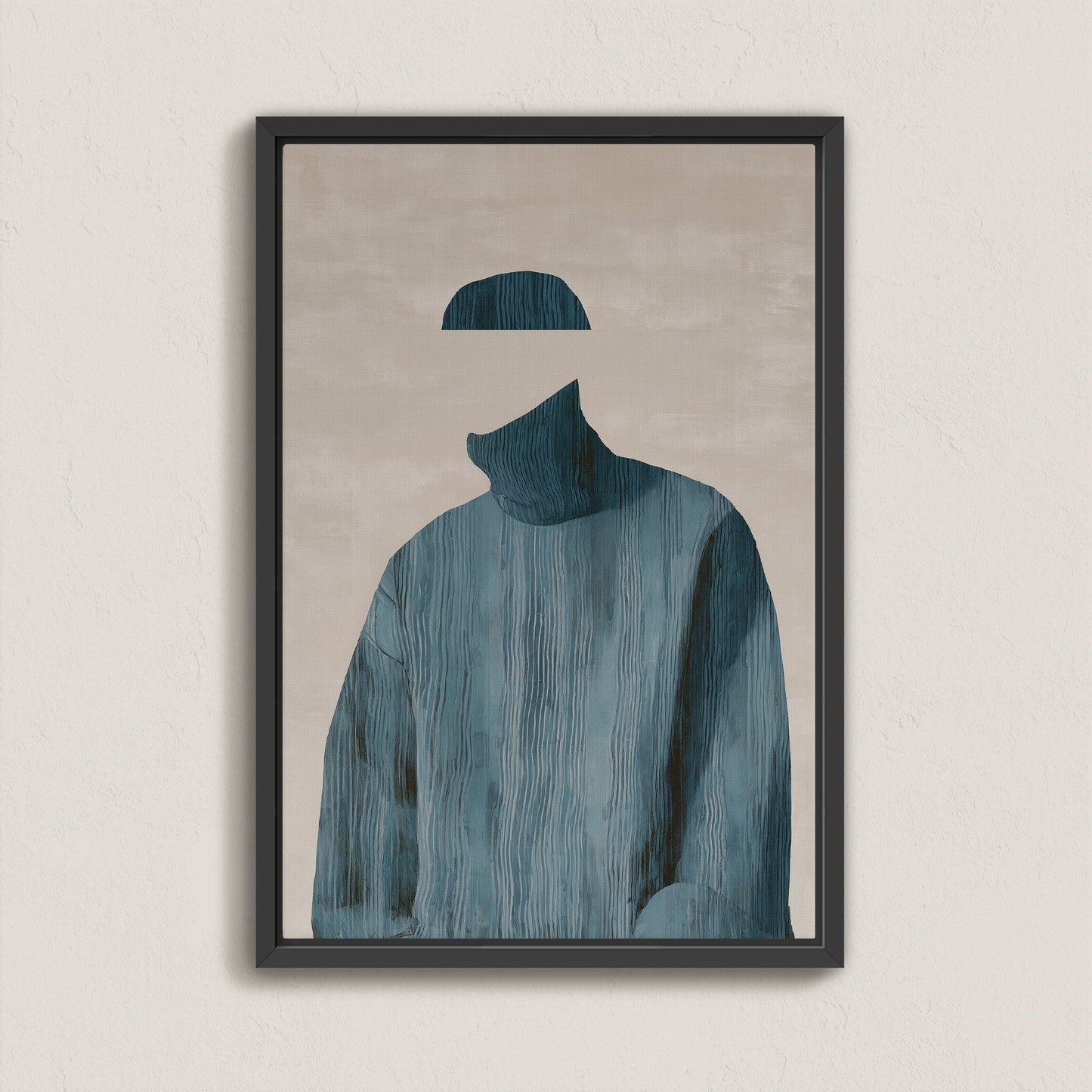 Hollow canvas print of faceless figure in blue textured sweater with muted neutral background in black frame