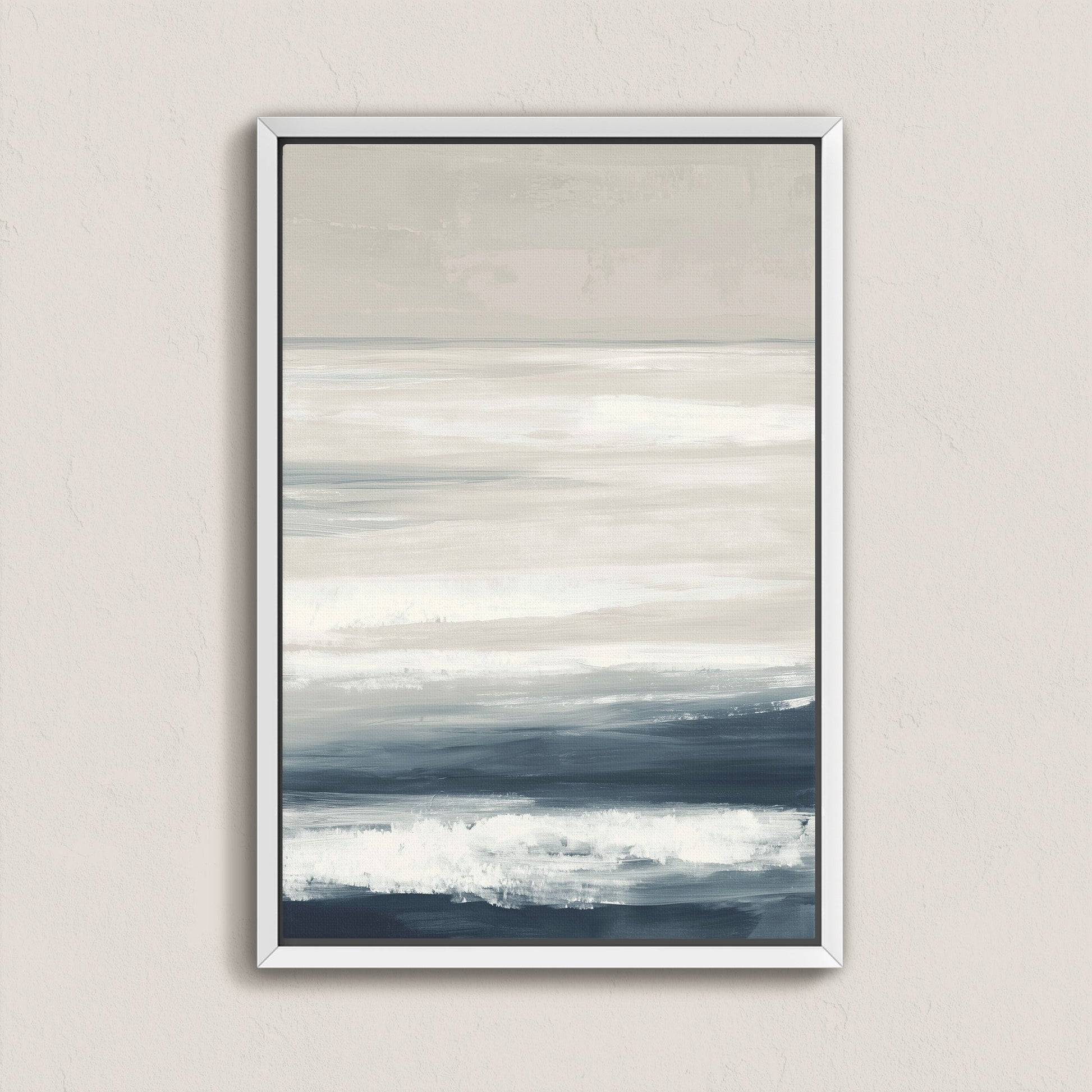Syd Canvas Print featuring calming layers of ivory, sand, and indigo depicting a serene shoreline in a modern white frame.