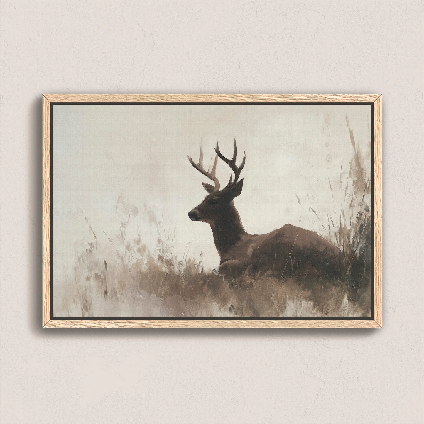 Haven Canvas Print of a resting deer in soft grasses with a neutral palette and natural wood frame