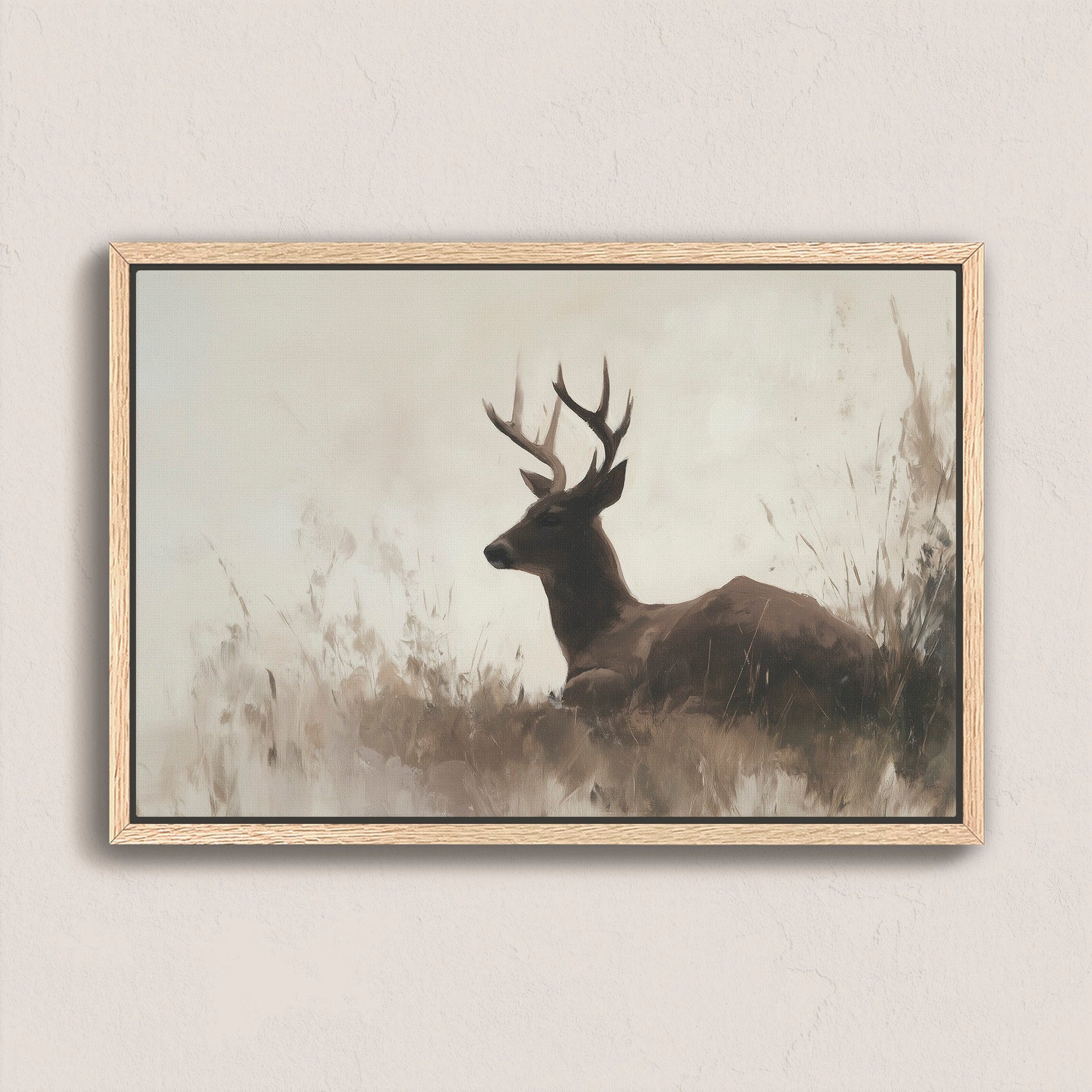 Haven Canvas Print of a resting deer in soft grasses with a neutral palette and natural wood frame