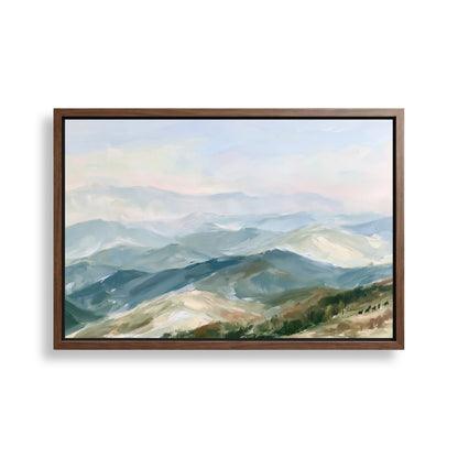 The image is a framed painting depicting a scenic mountain landscape with rolling hills and a hazy blue sky.