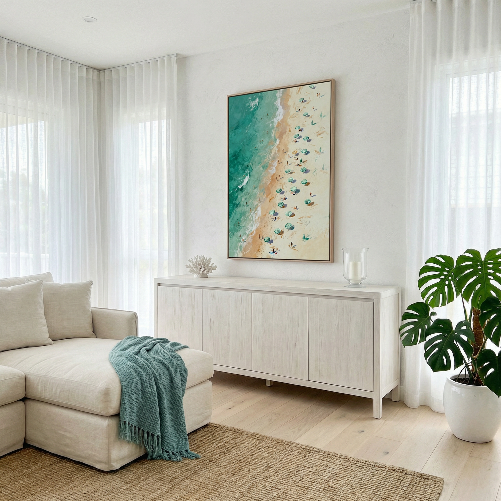 a cozy living room with a beige sofa, a white sideboard, and a large framed beach scene painting on the wall.