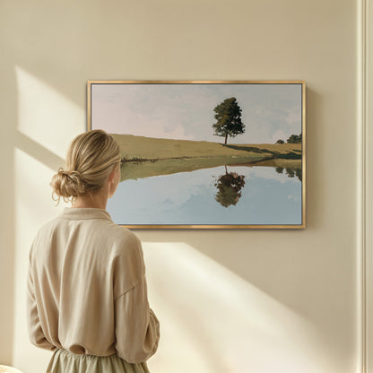 A woman stands in front of a painting, gazing at the serene landscape depicted in the artwork.