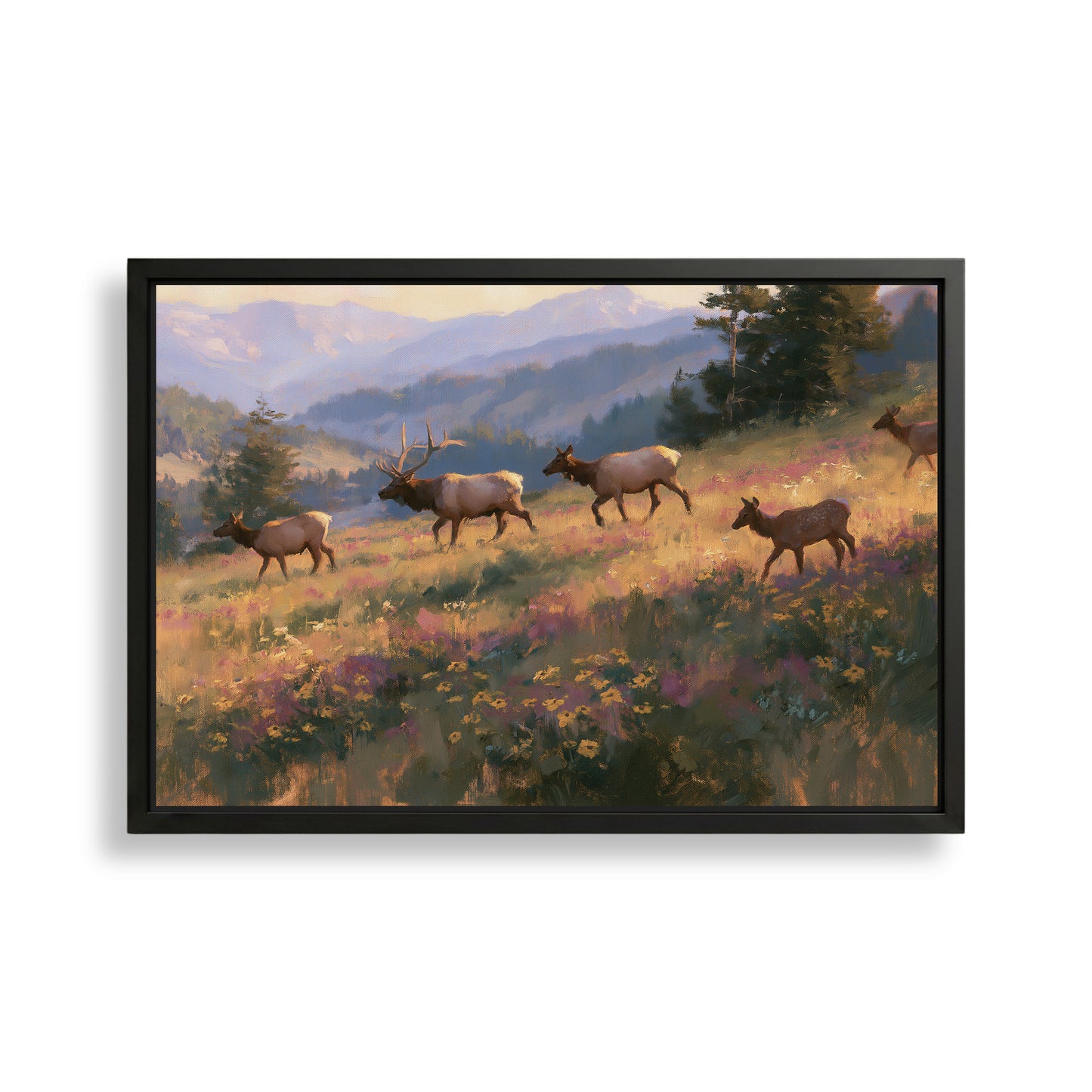 A framed painting depicting a group of elk walking through a field of wildflowers, with mountains in the background.