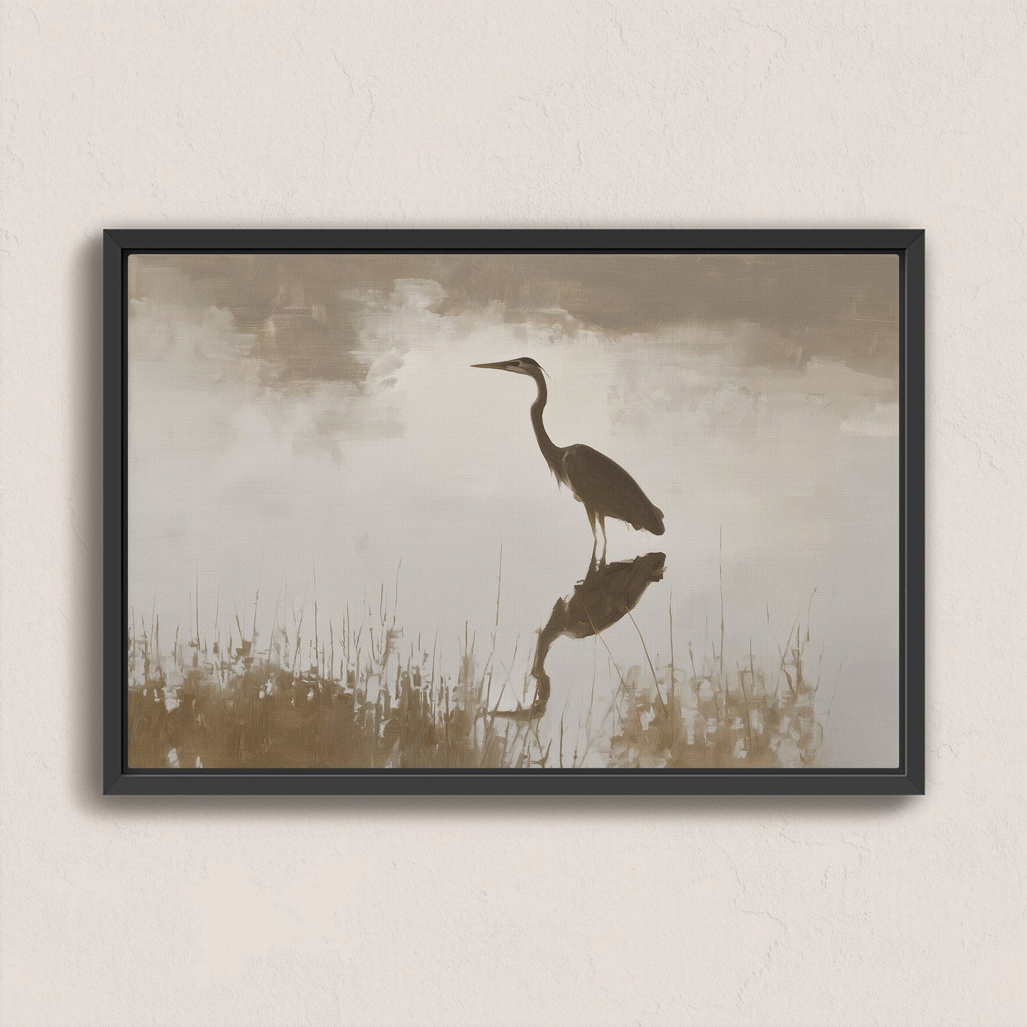 Wade canvas print featuring a heron standing in serene water with muted earth tones and soft light in a black frame