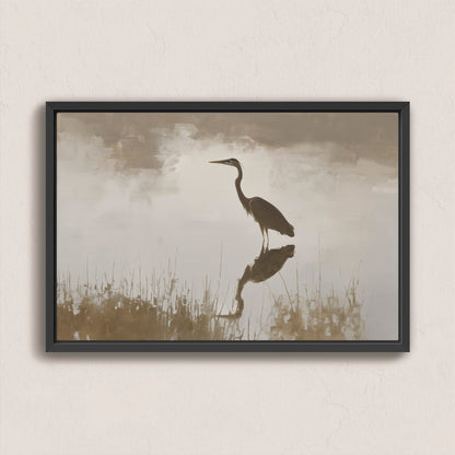 Wade canvas print featuring a heron standing in serene water with muted earth tones and soft light in a black frame