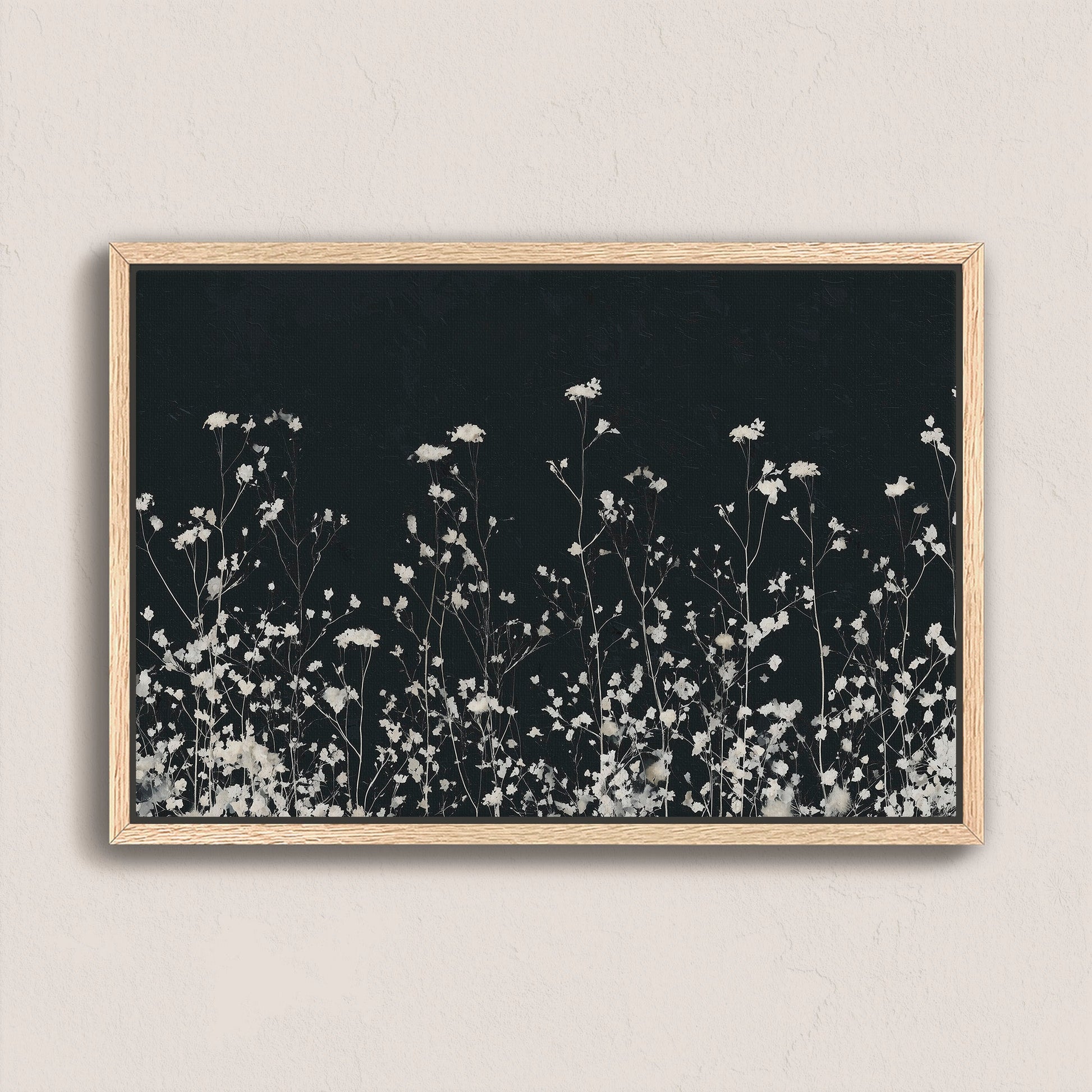 Noiré Canvas Wall Art with delicate white florals on deep charcoal background in natural wood frame